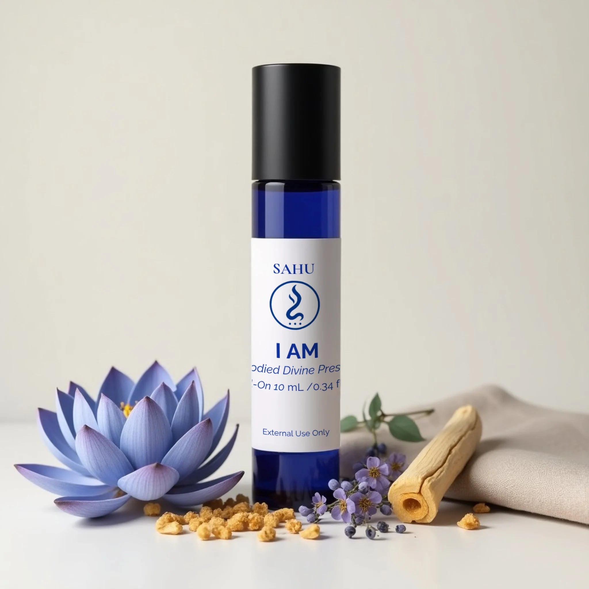Sahu I AM roll-on oil 10ml in blue bottle with lotus, herbs, and natural resin accents.