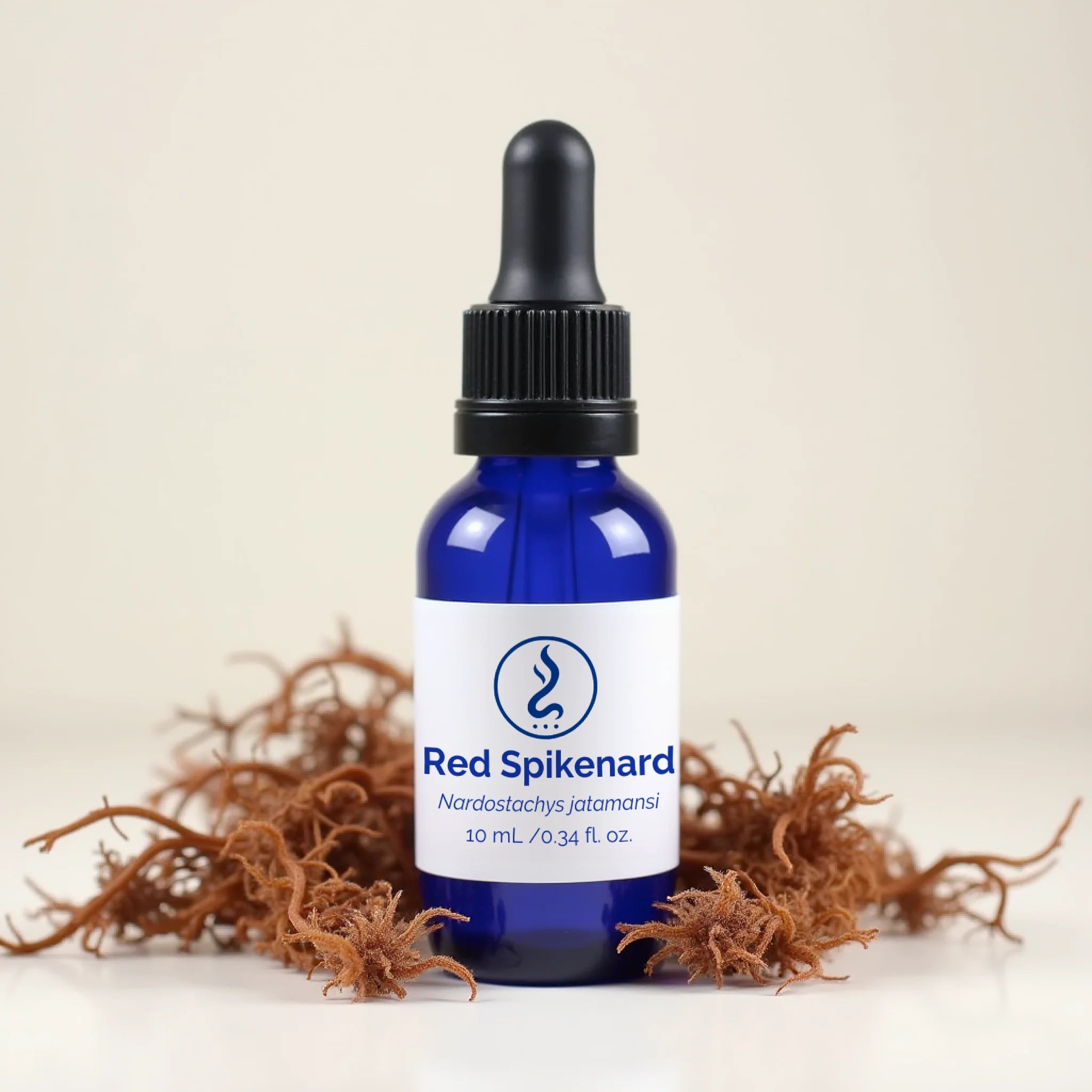 Sacred Red Spikenard oil in blue dropper bottle with roots, spiritual essence for meditation