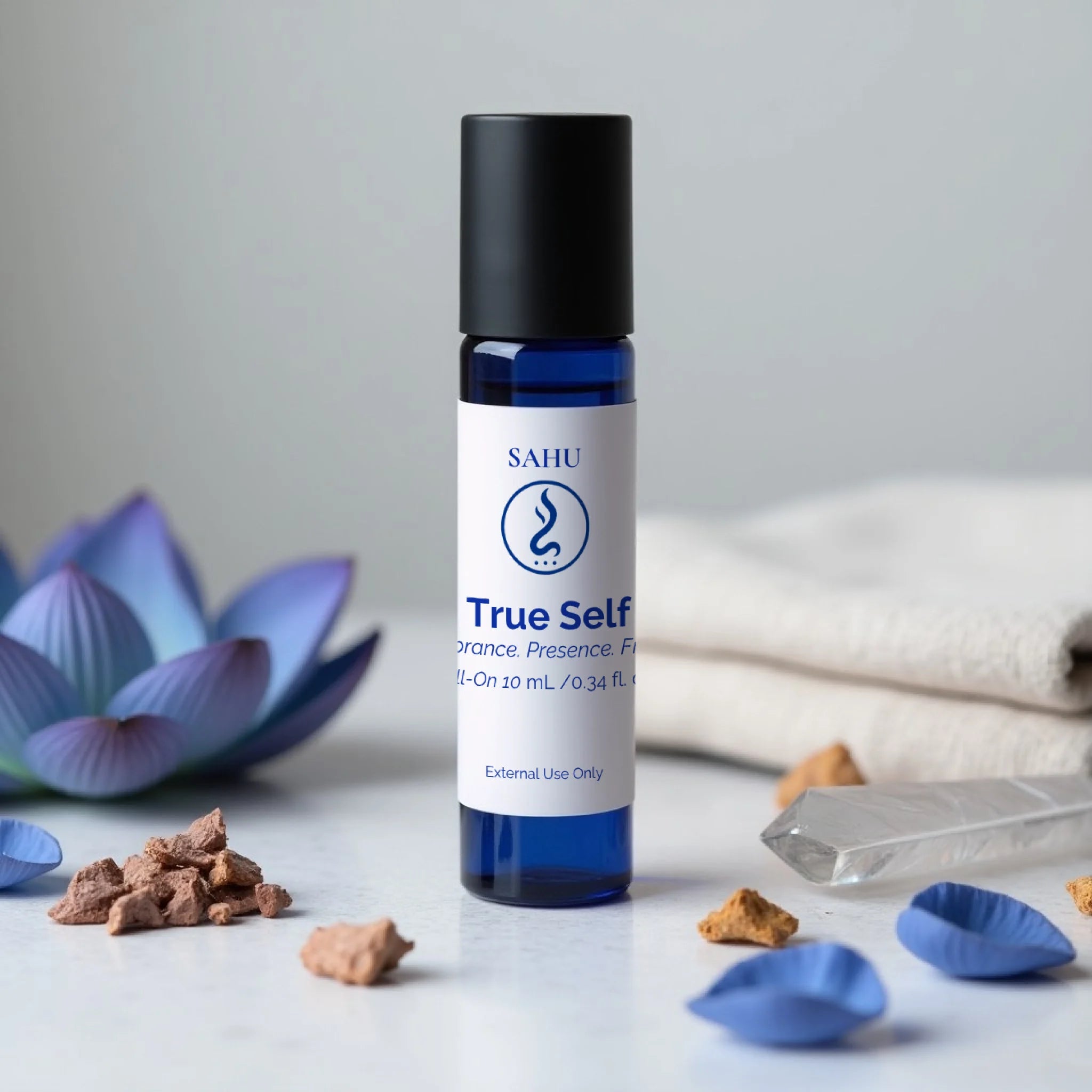 Sahu True Self blend product bottle with decorative elements on a light surface