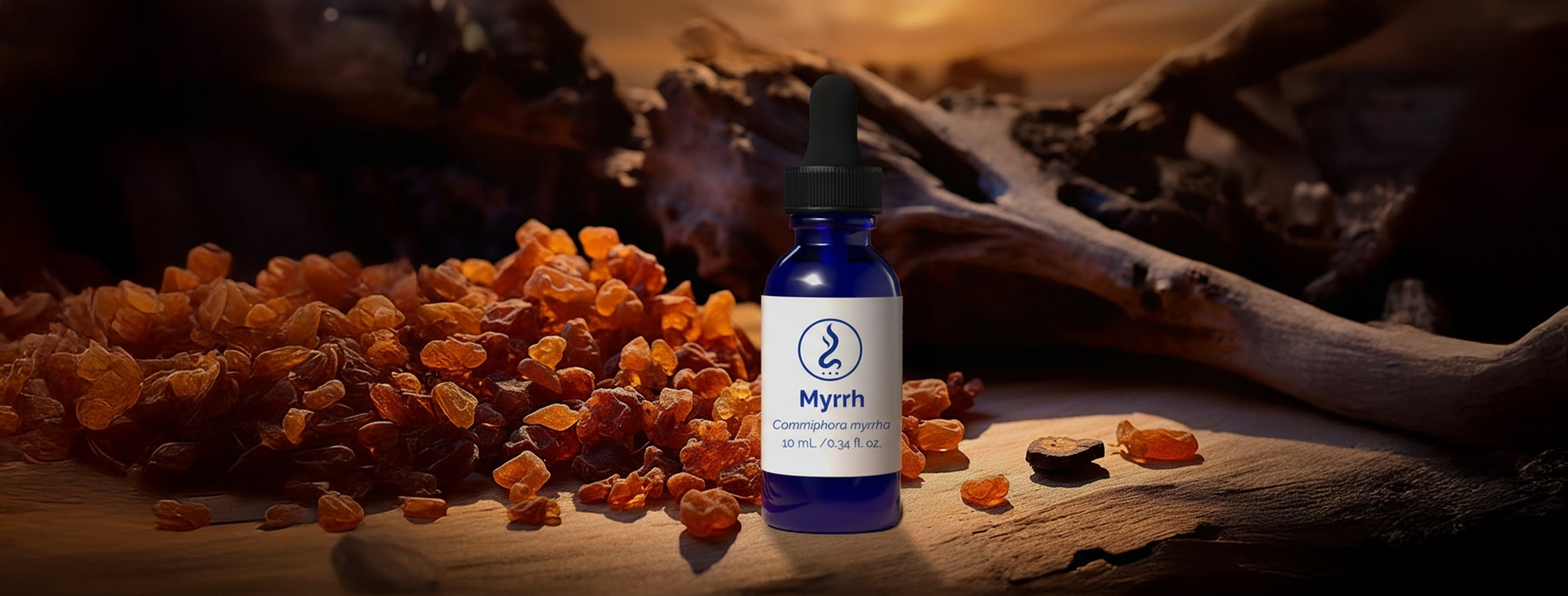 Blue glass bottle of myrrh essential oil placed beside scattered myrrh resin on a wooden surface with a warm, earthy background.